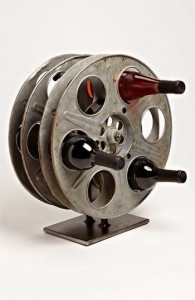 Upcycled movie reel wine rack